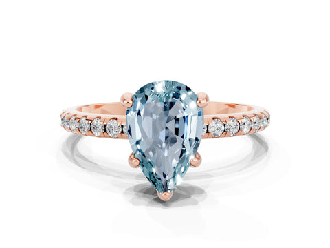 Rose gold Pear Cut Diamond Solitaire Ring with Four-Prong Setting and Pavé Band