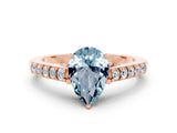 Rose gold Pear Cut Diamond Solitaire Ring with Pavé Band and Prong Setting