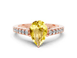 Rose gold Pear Cut Diamond Solitaire Ring with Pavé Band and Prong Setting