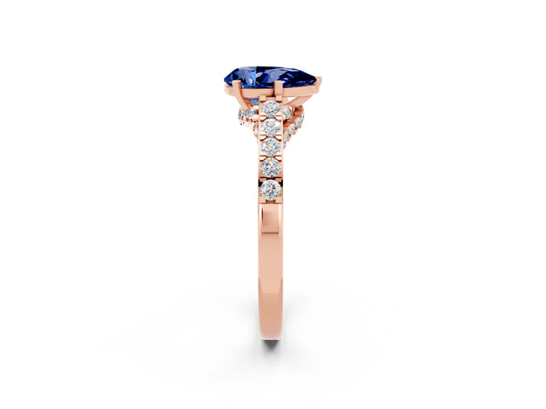 Rose gold Pear Cut Blue Sapphire Solitaire Ring with Crossover Gallery and Round  Pavé Band