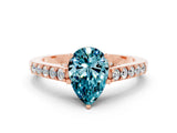 Rose gold Pear Cut Diamond Solitaire Ring with Pavé Band and Prong Setting
