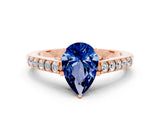 Rose gold Pear Cut Diamond Solitaire Ring with Pavé Band and Prong Setting