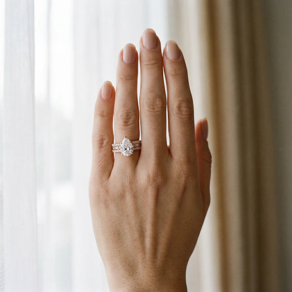 Rose gold Pear Cut Diamond Solitaire Ring with Pavé and Channel Set Band