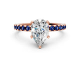 Rose gold Pear Cut Diamond Solitaire Ring with Round with Blue Sapphire side stone Pavé Band and Four-Prong Setting_36