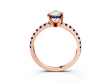 Rose gold Pear Cut Diamond Solitaire Ring with Round with Blue Sapphire side stone Pavé Band and Four-Prong Setting_39