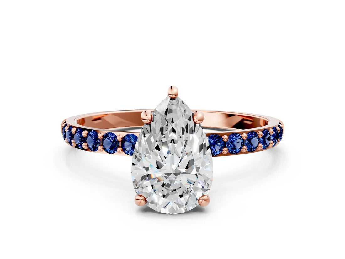 Rose gold Pear Cut Diamond Solitaire Ring with Round with Blue Sapphire side stone Pavé Band and Prong Setting_12