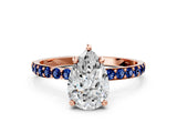 Rose gold Pear Cut Diamond Solitaire Ring with Round with Blue Sapphire side stone Pavé Band and Prong Setting_12