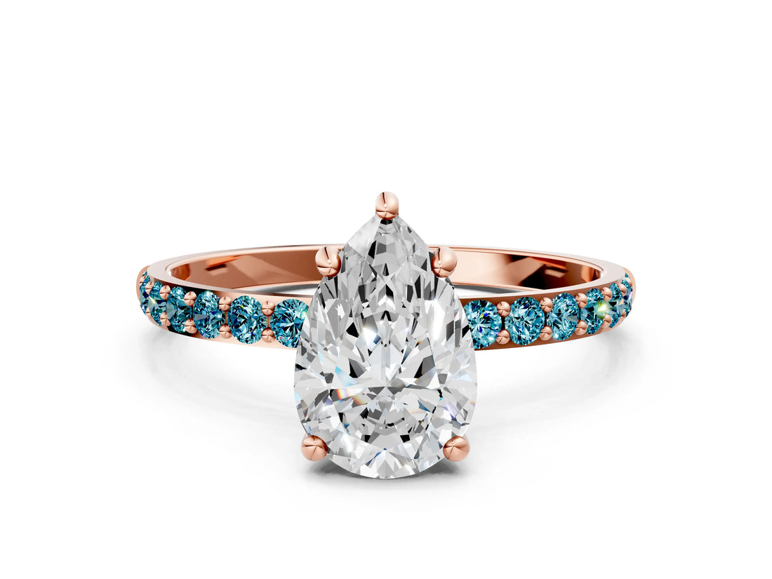 Rose gold Pear Cut Diamond Solitaire Ring with Round with Blue Topaz side stone Pavé Band and Prong Setting_12