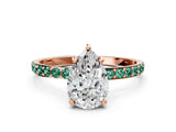 Rose gold Pear Cut Diamond Solitaire Ring with Round with Green Sapphire side stone Pavé Band and Prong Setting
