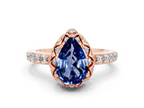 Rose gold Pear Cut Diamond Solitaire Ring with Shared Prong Pavé Band