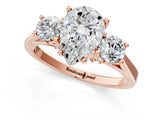 Rose gold Pear Cut Diamond Three-Stone Engagement Ring with Prong Setting and Pavé Band_4