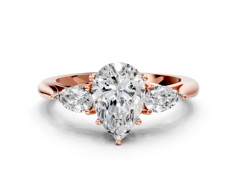 Rose gold Pear Cut Diamond Three-Stone Ring with Pear with Moissanite side stone Side Stones and Prong Setting