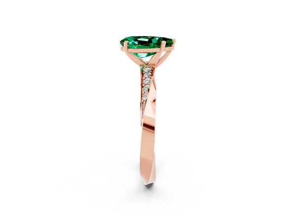 Rose gold Pear Cut Emerald Engagement Ring with Side Stone Accents and Four-Prong Setting
