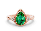 Rose gold Pear Cut Emerald Halo Ring with Tapered Band and Four-Prong Setting