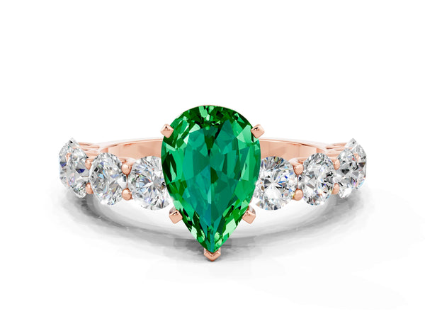 Rose gold Pear Cut Emerald Prong Setting with Side Stones on a Pave Band
