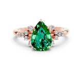 Rose gold Pear Cut Emerald Ring with Side Stones and Four-Prong Setting_36