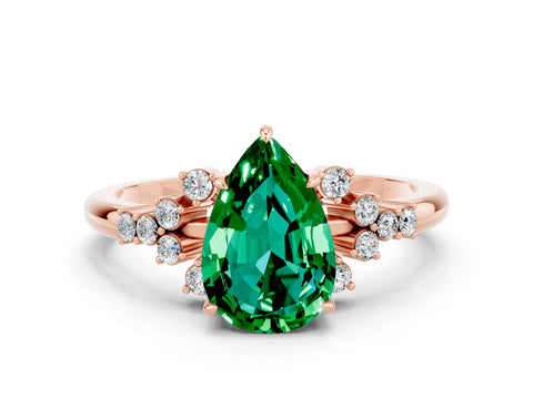 Rose gold Pear Cut Emerald Ring with Side Stones and Four-Prong Setting_36