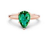 Rose gold Pear Cut Emerald Solitaire Engagement Ring with Round Band and Four-Prong Setting