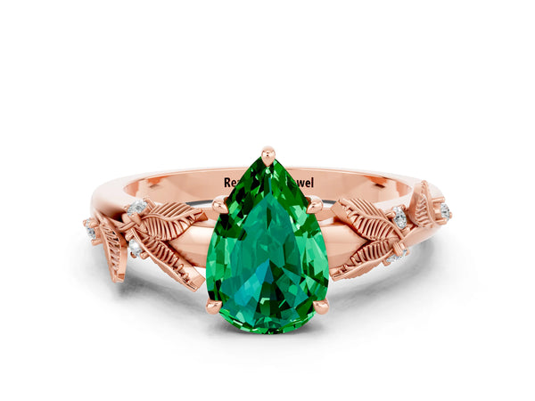 Rose gold Pear Cut Emerald Solitaire Ring with Leaf Motif Band and Four-Prong Setting