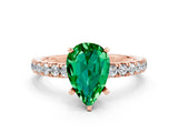 Rose gold Pear Cut Emerald Solitaire Ring with Pavé Accents and Four-Prong Setting
