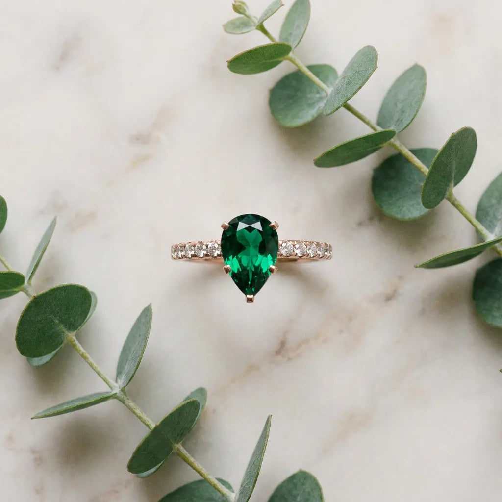 Rose gold Pear Cut Emerald Solitaire Ring with Round  Pavé Band and Four-Prong Setting_45