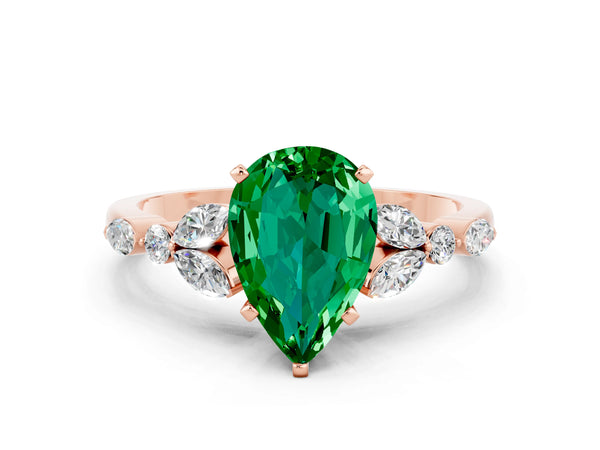 Rose gold Pear Cut Emerald Solitaire Ring with Side Stones and Four-Prong Setting