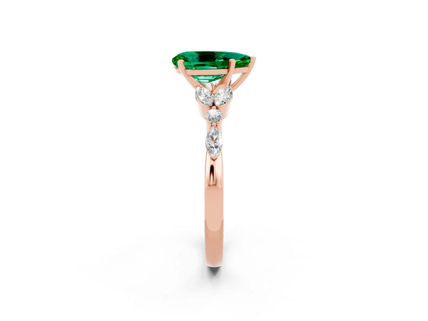 Rose gold Pear Cut Emerald Solitaire Ring with Side Stones and Four-Prong Setting