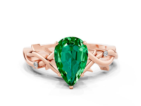 Rose gold Pear Cut Emerald Solitaire Ring with Twisted Band and Prong Setting