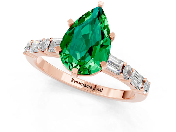 Rose gold Pear Cut Emerald Solitaire with Side Baguettes and Channel Set Band