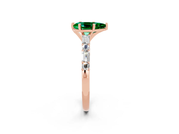 Rose gold Pear Cut Emerald Solitaire with Side Baguettes and Channel Set Band