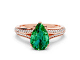 Rose gold Pear Cut Emerald Split Shank Engagement Ring with Pavé Band