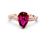 Rose gold Pear Cut Garnet Engagement Ring with Side Stone Accents and Four-Prong Setting_60