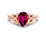 Rose gold Pear Cut Garnet Solitaire Engagement Ring with Celtic Knot Band and Four-Prong Setting