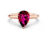 Rose gold Pear Cut Garnet Solitaire Engagement Ring with Round Band and Four-Prong Setting
