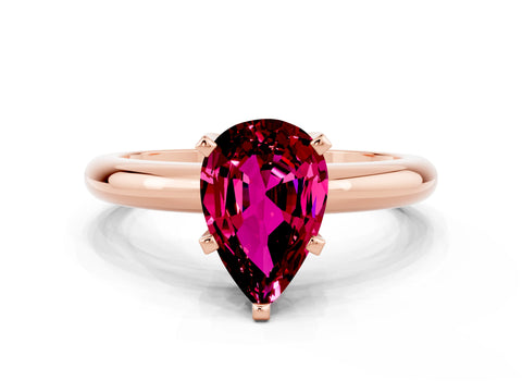 Rose gold Pear Cut Garnet Solitaire Engagement Ring with Round Band and Four-Prong Setting