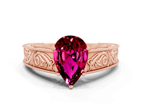 Rose gold Pear Cut Garnet Solitaire Ring with Engraved Band and Four-Prong Setting