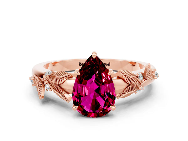 Rose gold Pear Cut Garnet Solitaire Ring with Leaf Motif Band and Four-Prong Setting