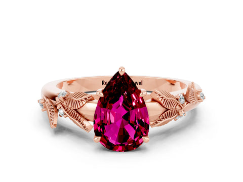 Rose gold Pear Cut Garnet Solitaire Ring with Leaf Motif Band and Four-Prong Setting