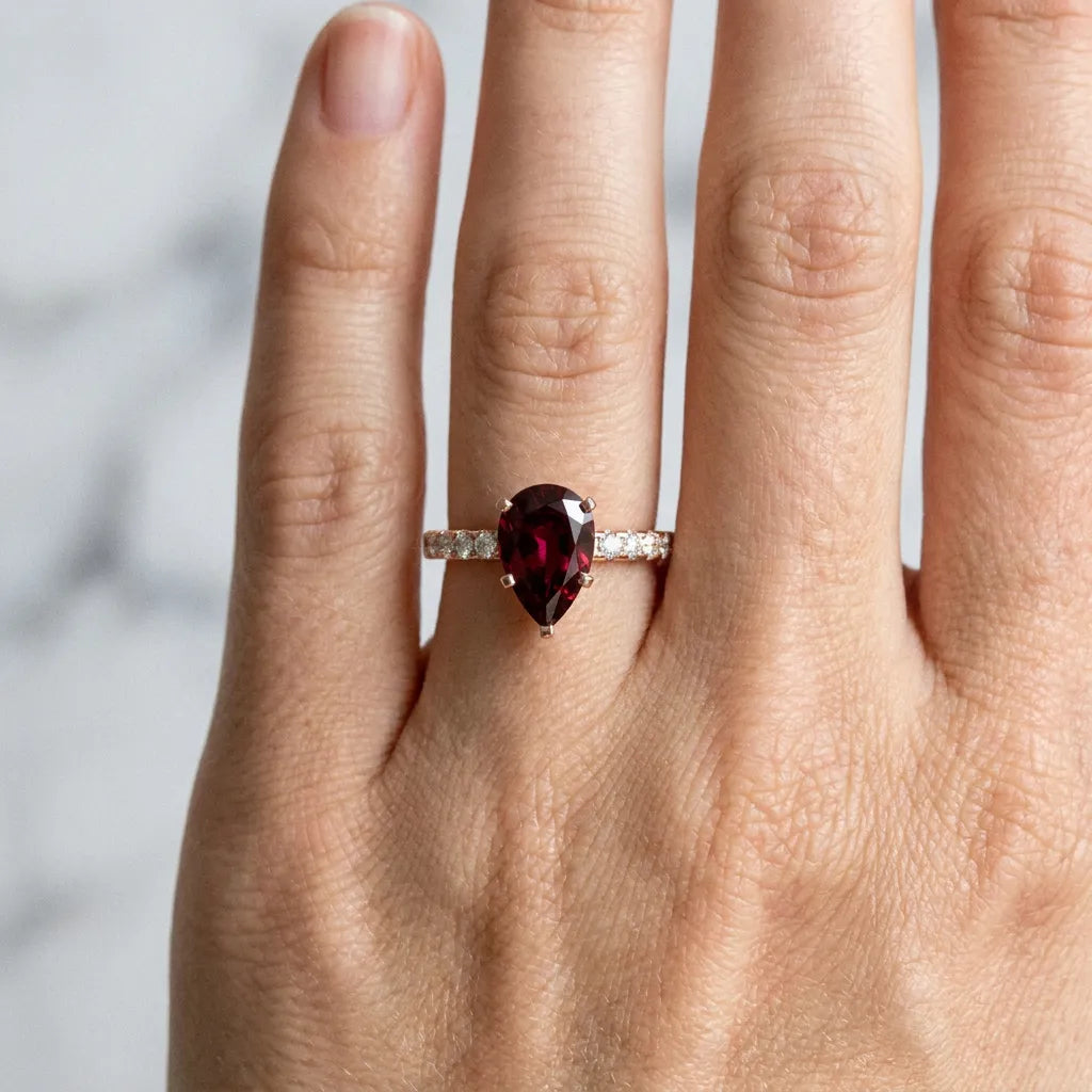 Rose gold Pear Cut Garnet Solitaire Ring with Round  Pavé Band and Four-Prong Setting_30