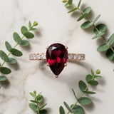 Rose gold Pear Cut Garnet Solitaire Ring with Round  Pavé Band and Four-Prong Setting_33
