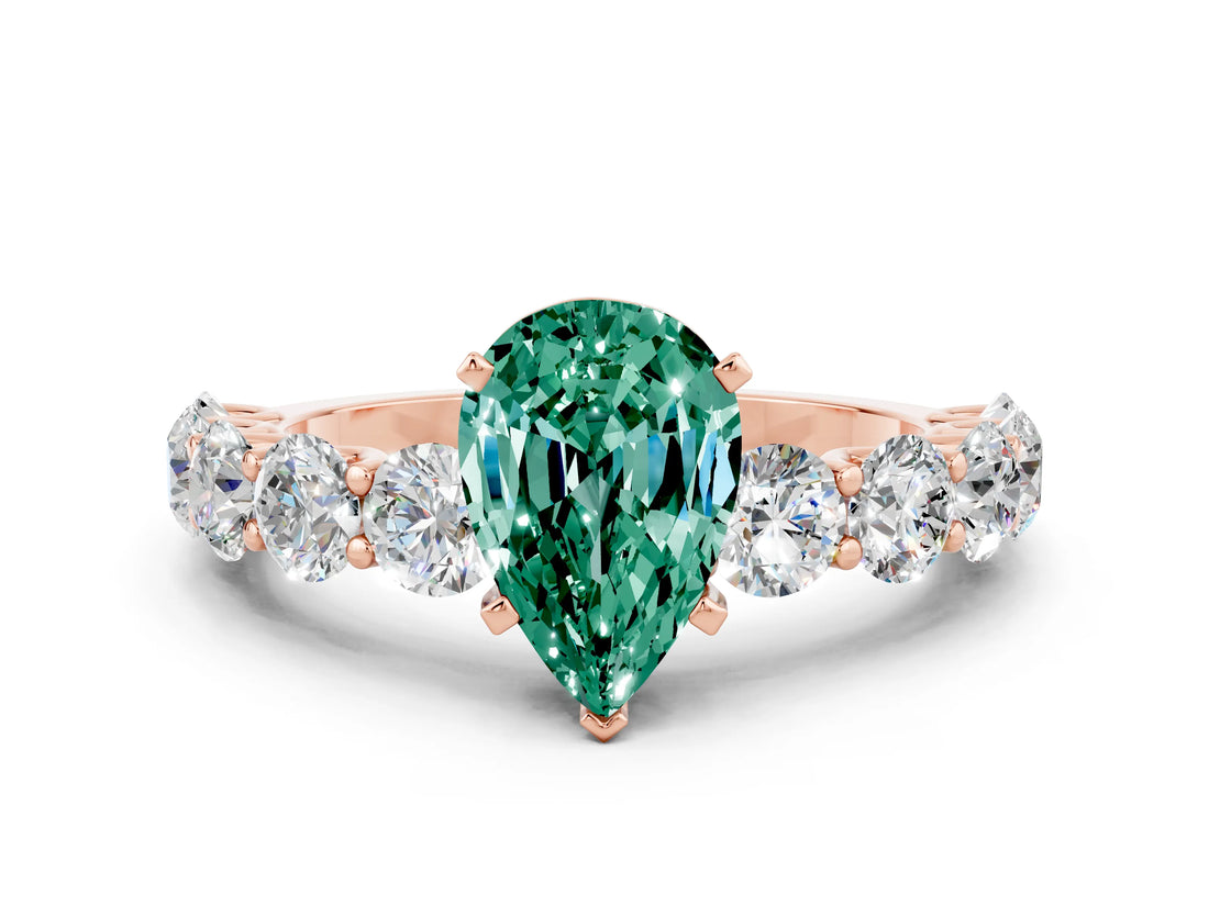 Rose gold Pear Cut Green Sapphire Prong Setting with Side Stones on a Pave Band