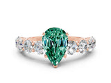 Rose gold Pear Cut Green Sapphire Prong Setting with Side Stones on a Pave Band