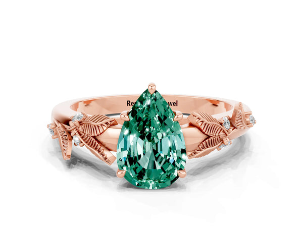 Rose gold Pear Cut Green Sapphire Solitaire Ring with Leaf Motif Band and Four-Prong Setting