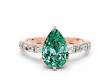 Rose gold Pear Cut Green Sapphire Solitaire with Side Baguettes and Channel Set Band