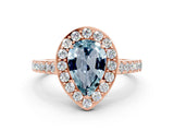 Rose gold Pear Cut Halo Diamond Ring with Pavé Band and Three-Prong Setting