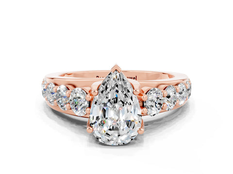 Rose gold Pear Cut Moissanite Engagement Ring with Pavé Band and Four-Prong Setting