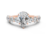Rose gold Pear Cut Moissanite Prong Setting with Side Stones on a Pave Band
