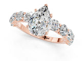 Rose gold Pear Cut Moissanite Prong Setting with Side Stones on a Pave Band_1