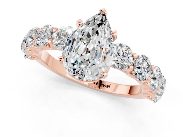 Rose gold Pear Cut Moissanite Prong Setting with Side Stones on a Pave Band