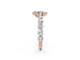 Rose gold Pear Cut Moissanite Prong Setting with Side Stones on a Pave Band_2